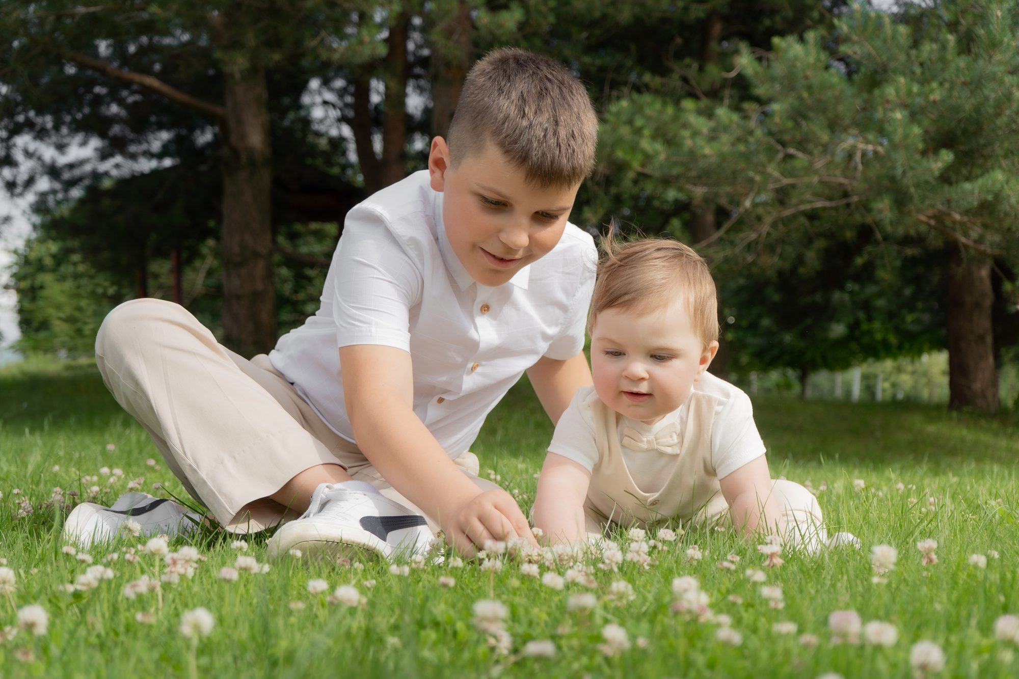 Two brothers playing together in a summer meadow
